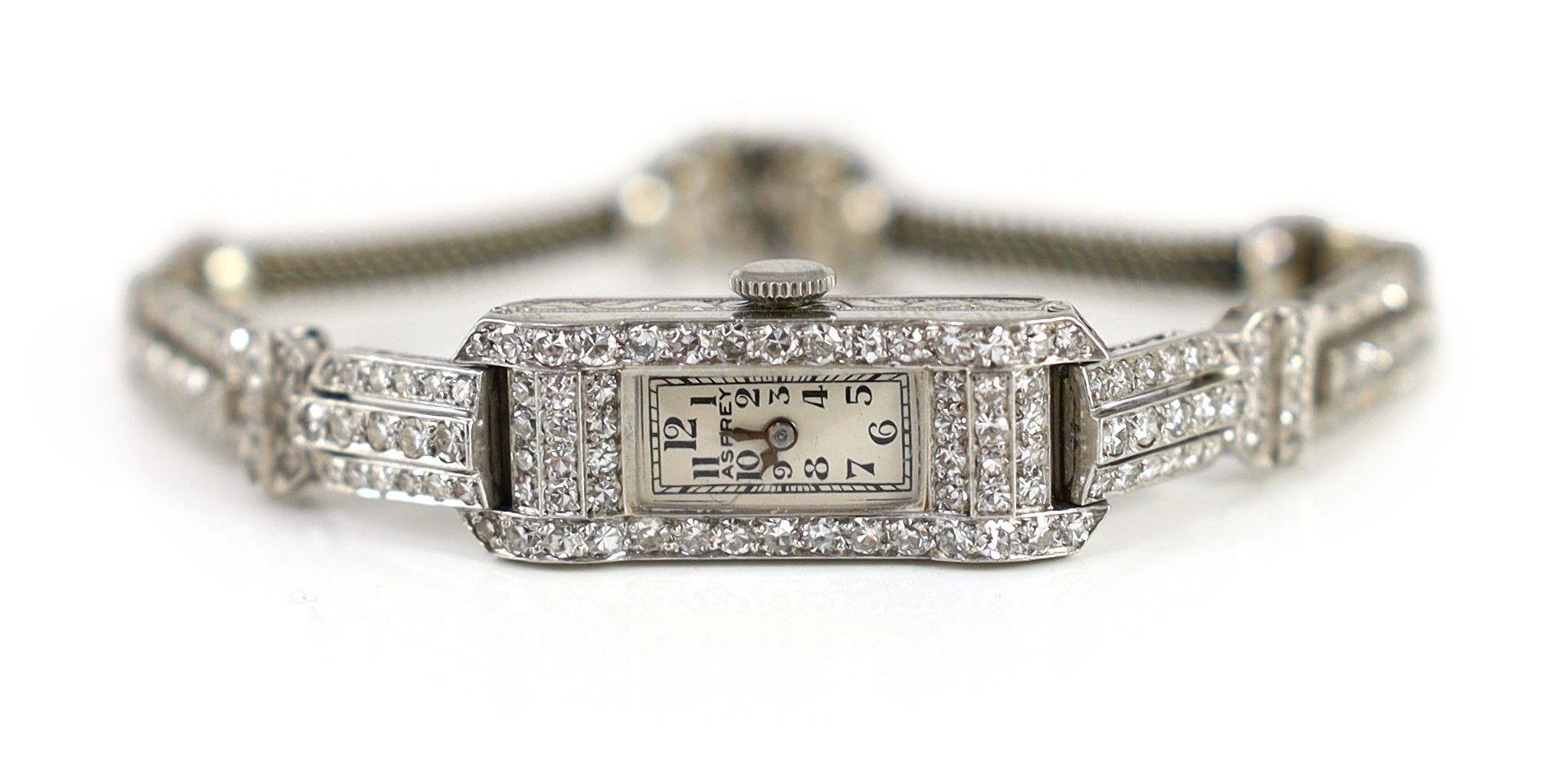 A lady's mid 20th century platinum and diamond set manual wind cocktail watch, retailed by Asprey, approx. 16cm, gross weight 23.2 grams.